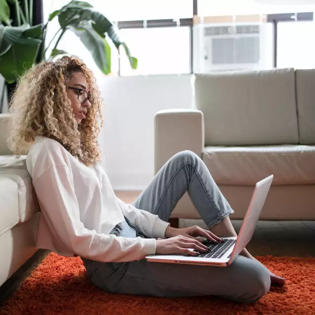 Woman working on laptop from home