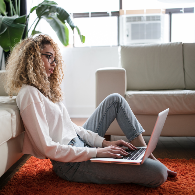 Woman working on laptop from home