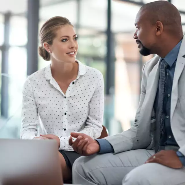 Woman and man meeting with a laptop