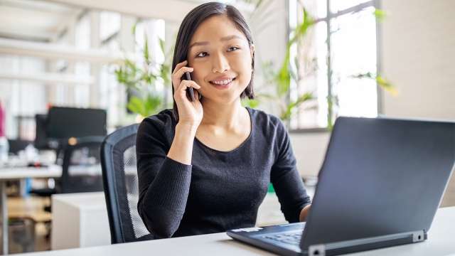 Woman smiling on cell phone