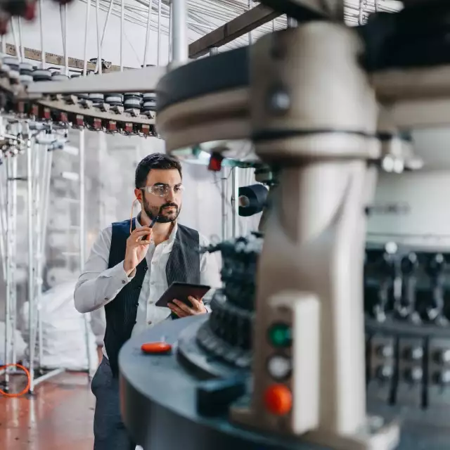 Man walking around machinery