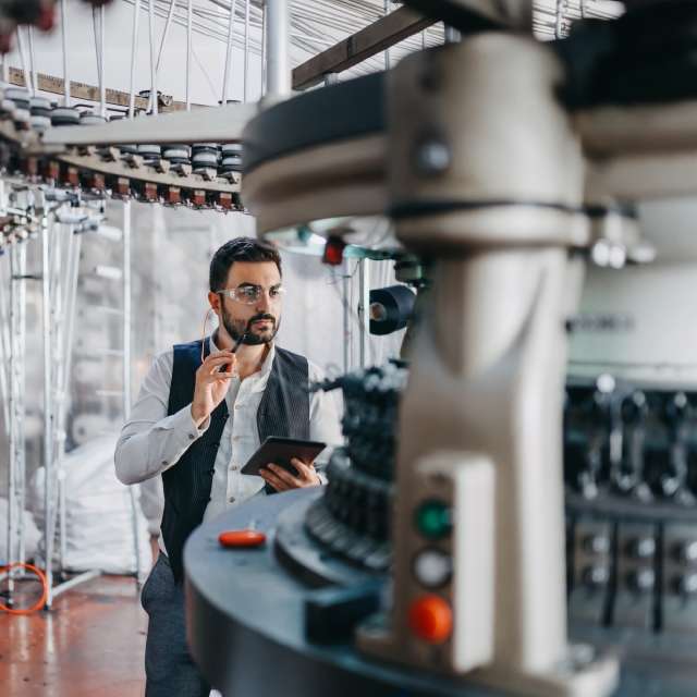 Man walking around machinery