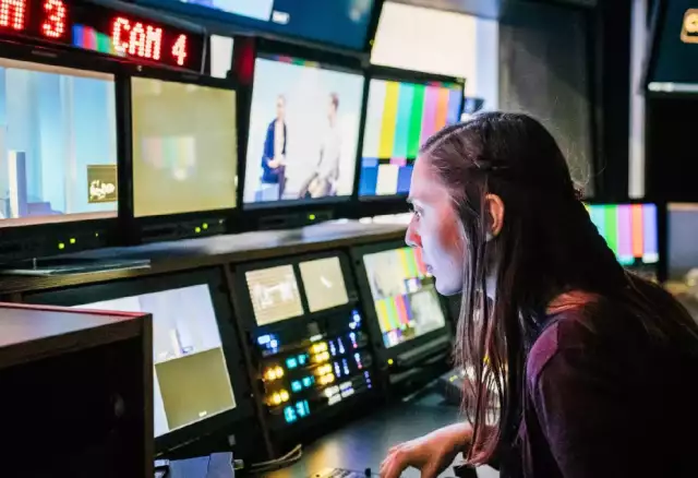Woman looking at screens