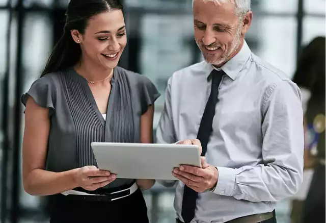 Man and woman looking at tablet