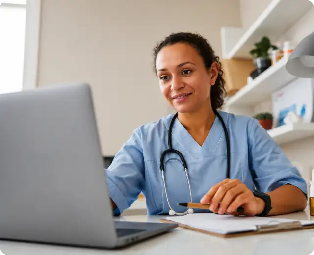 Doctor looking at laptop