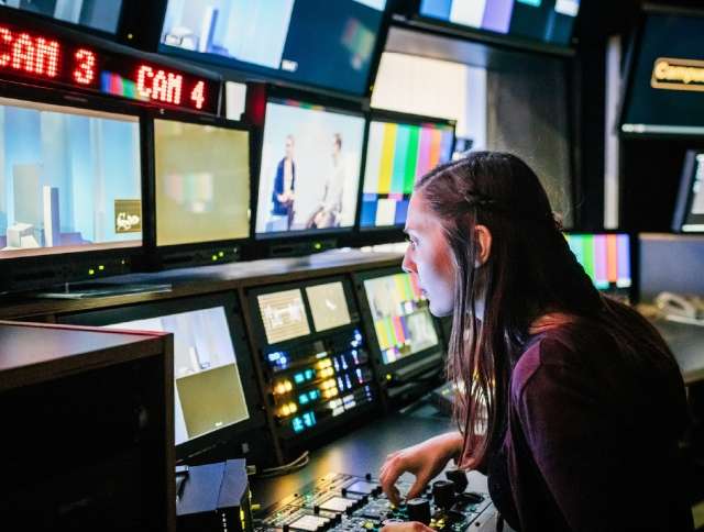 Woman working in news recording studio