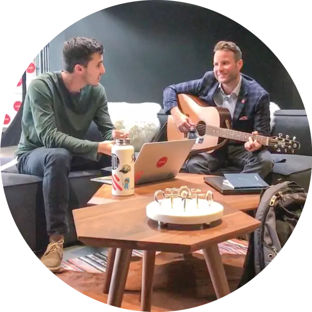 Man playing guitar at Conga office