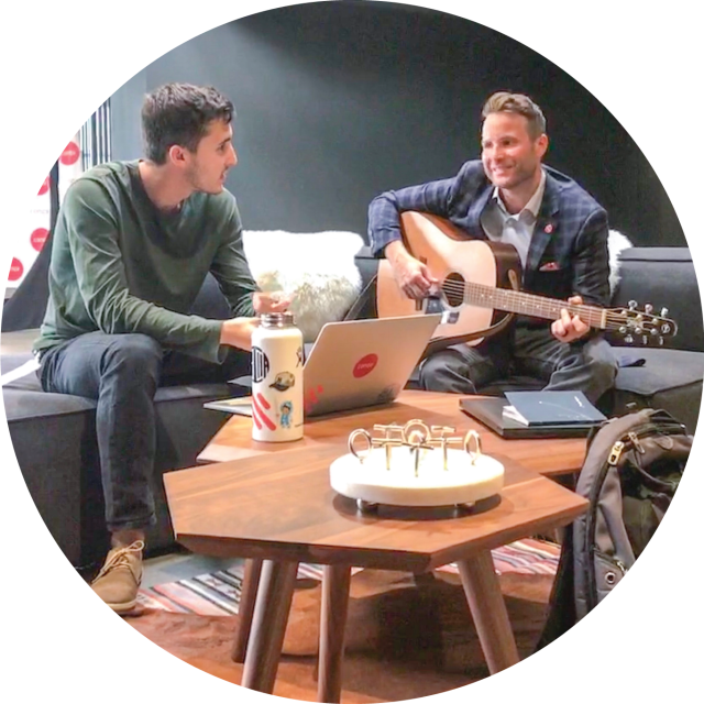 Man playing guitar at Conga office