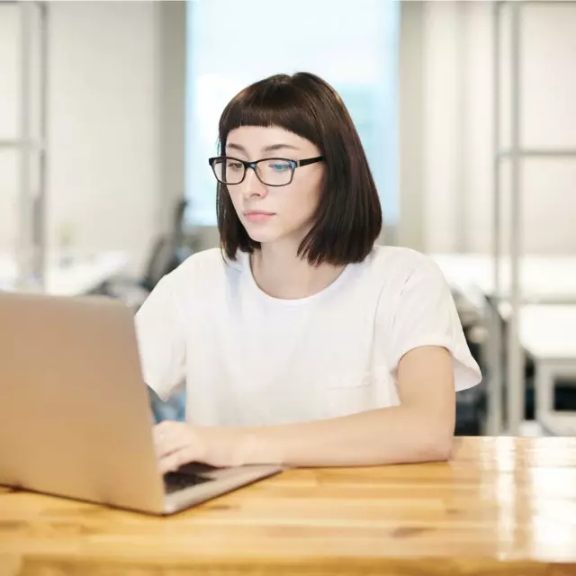 Woman typing on laptop