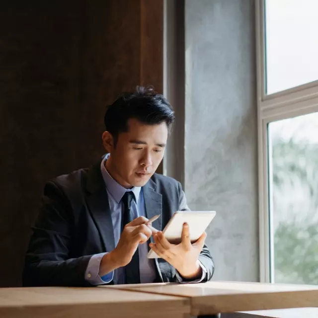 Man using Conga Contracts on tablet