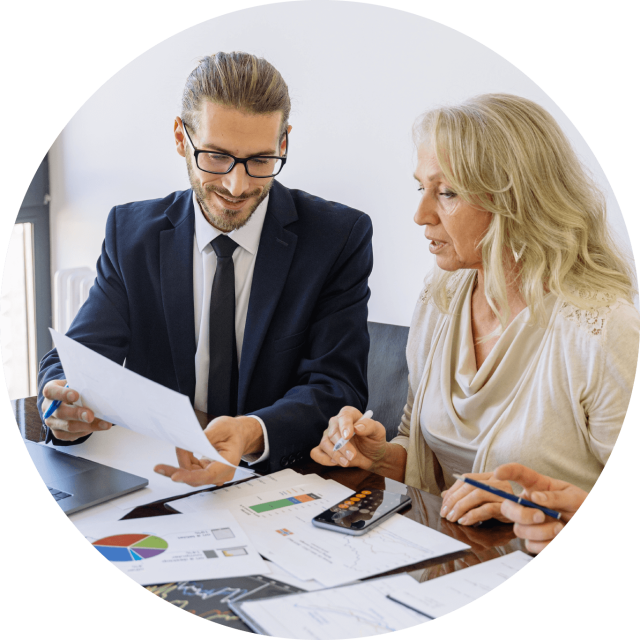 Man and woman discussing a report 