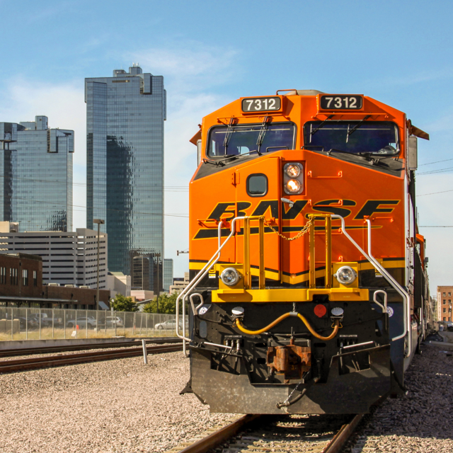 Train traveling past a city