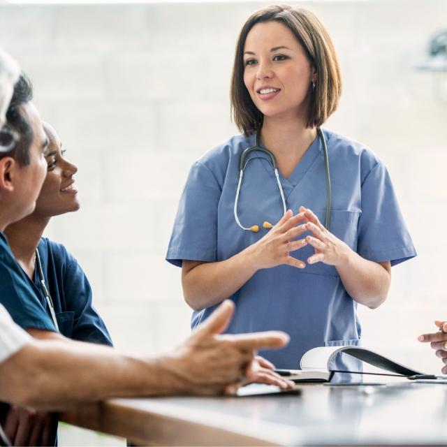 Nurse talking to other nurses