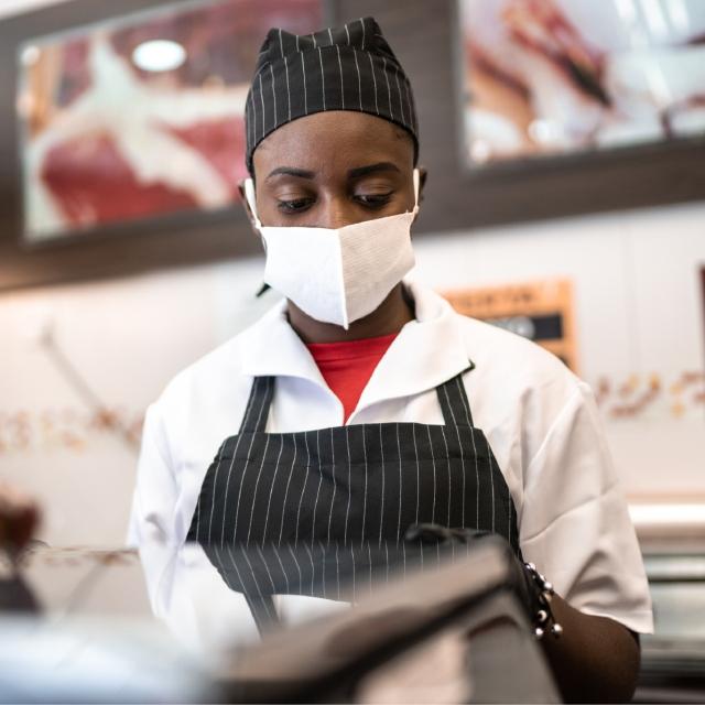 Woman working at fast food restaurant