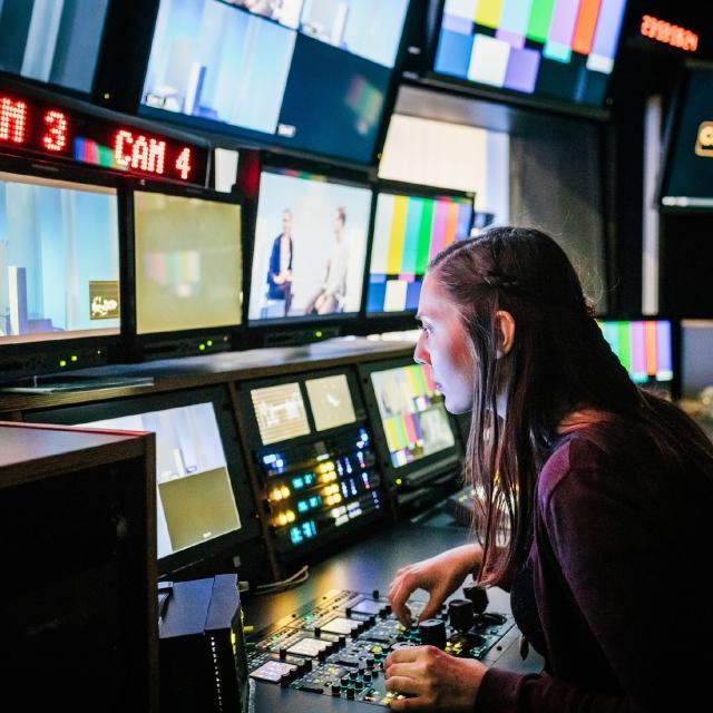 Woman working in news recording studio