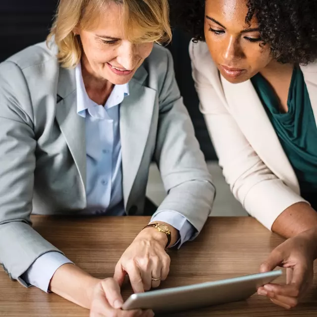 Women looking at tablet