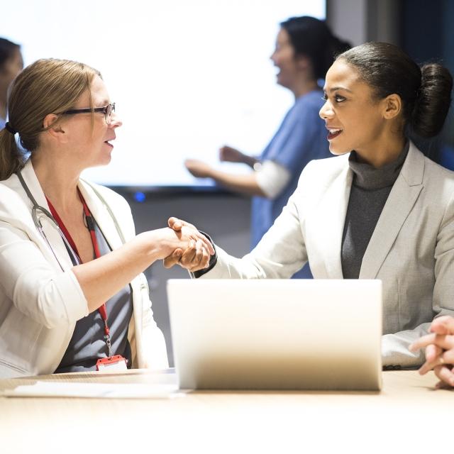 Legal professionals shaking hands